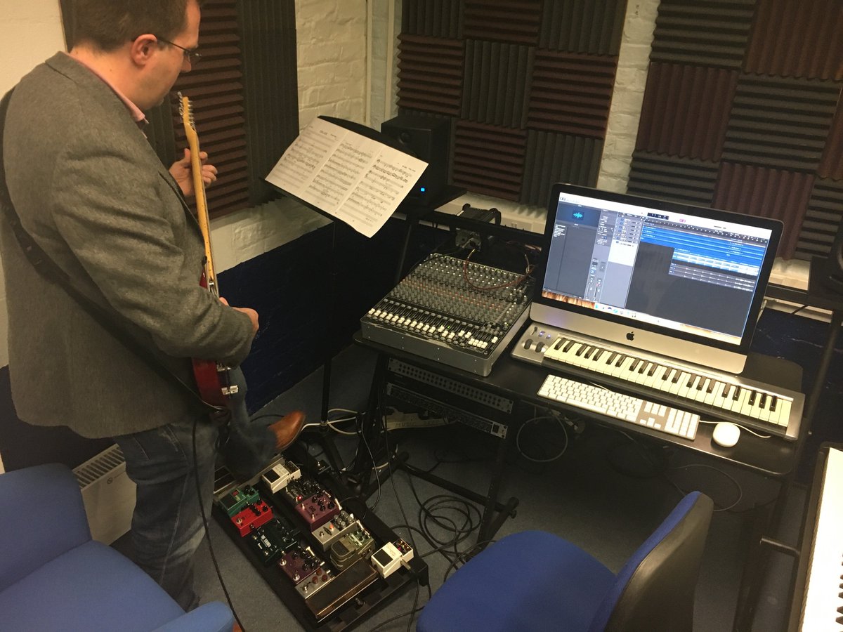 Tim recording electric guitar