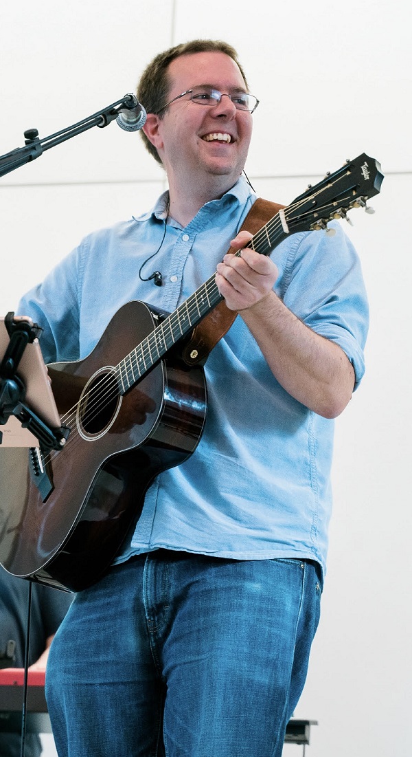 Tim playing guitar